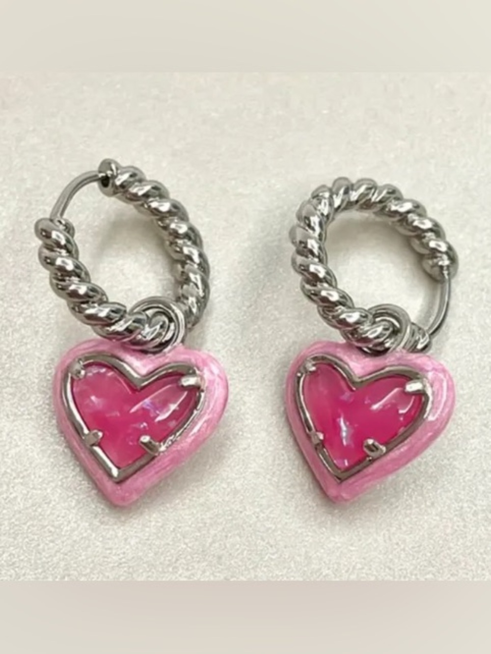 Kendra Scott Silver Twisted Hoop Earrings with Pink Heart Charms